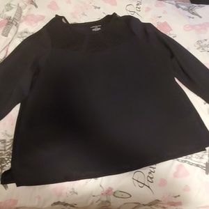 Black blouse with see through detail.